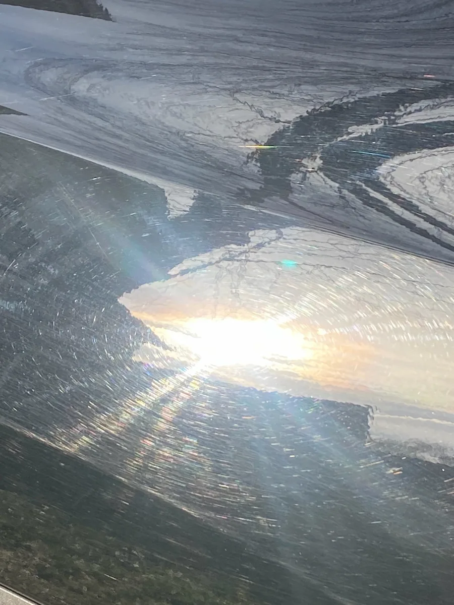 Before: spiderweb swirls in direct sun
